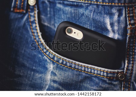 smartphone in pocket close up
