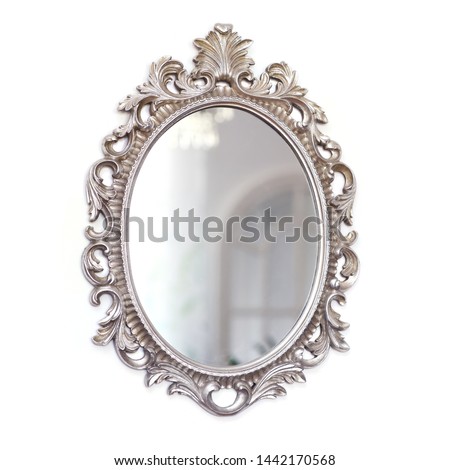 vintage design, silver decorative frame mirror, antoque mirror, classical design mirror.  Royalty-Free Stock Photo #1442170568