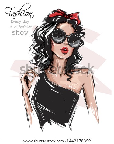 Hand drawn beautiful young woman in sunglasses. Stylish girl with bow on her head. Fashion woman look. Sketch. Vector illustration. Royalty-Free Stock Photo #1442178359