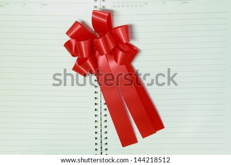 Red Ribbon on Blank White  Realistic Spiral Notepad Notebook.