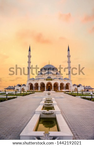 Beautiful sunset view of Sharjah New Mosque second largest mosque in United Arab Emirates beautiful traditional Islamic architecture Design new tourist attraction in Middle east, ramadan kareem image Royalty-Free Stock Photo #1442192021