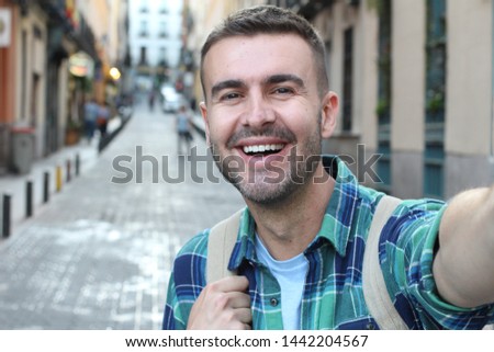 Very handsome man taking selfie 
