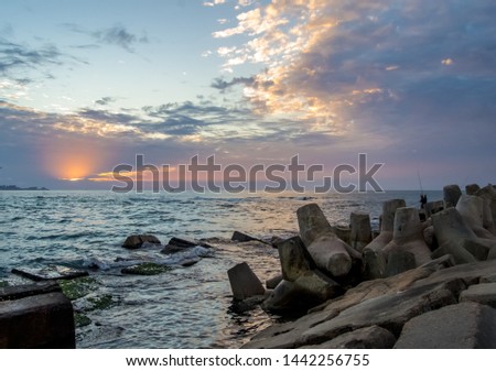 Sunlight between colorful clouds at alexandria coast