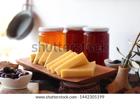 breakfast ingredients on the table. 
 olives,cheese,honey Royalty-Free Stock Photo #1442305199