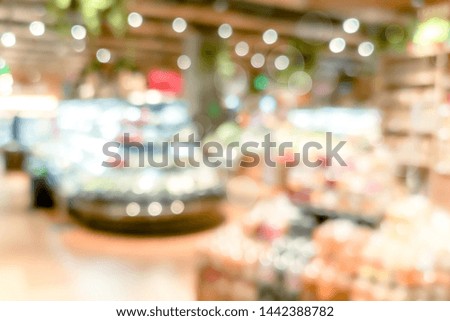 Blur Shopping mall background with bokeh light, golden color background