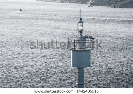 Navigation lighthouse on the sea