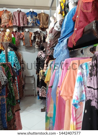 various batik clothes and dress collection on the store in Indonesia  Royalty-Free Stock Photo #1442407577