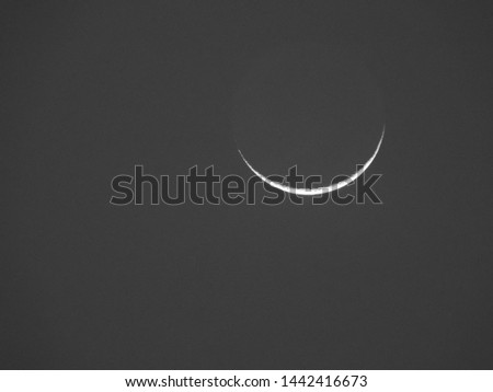 One day age moon background / New moon is more or less between the Earth and sun crossing the sky with the sun during the day