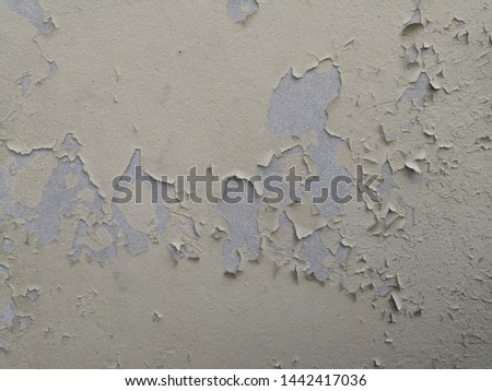 Paint is peeling off the building wall.Surface peeling paint peeling off the white.