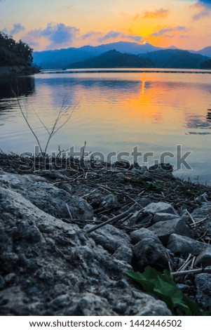enjoy the sunset on the edge of the lake