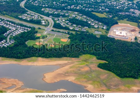 Aerial View of Baseball Fields taken from Flying Airplane on Blur Background