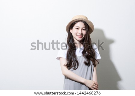 Portrait of a young woman dressed for summer