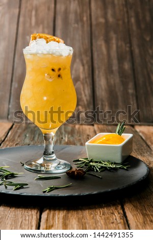 Lemonade or juice. Alcohol drink or cocktail. Images for bar or restaurant menu. Yellow drink with ice