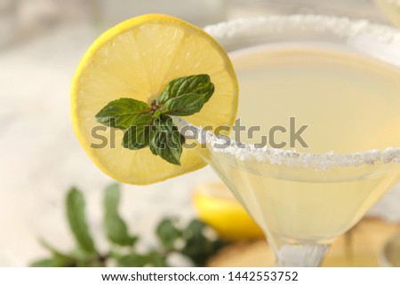 Margarita cocktail, Alcoholic drink, Margarita cocktail with lemon and mint and salt on a bright table. bar. bar stock and accessories. close-up
