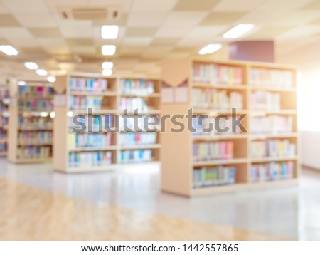 books on bookshelf in public library,  abstract blur defocused background