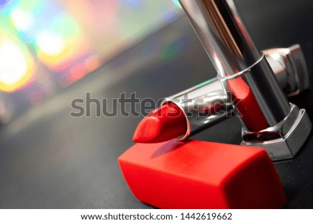 red and beige lipstick, colorful background