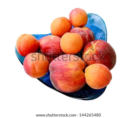 Closeup picture of peaches and apricots isolated on white
