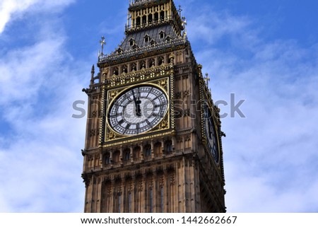 a close view of the big ben in the background of a beautiful sky