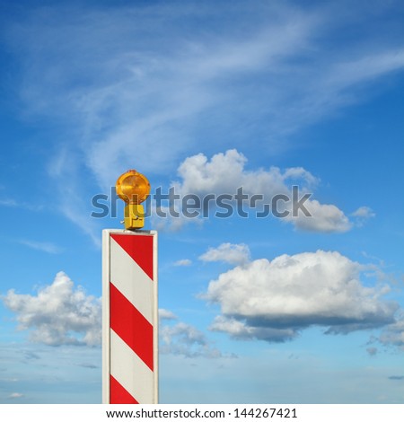Roadworks, road sign  with blue sky and clouds