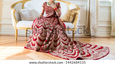 Pakistani Indian bride showing wedding lehenga sharara dress and jewelry Royalty-Free Stock Photo #1442684135