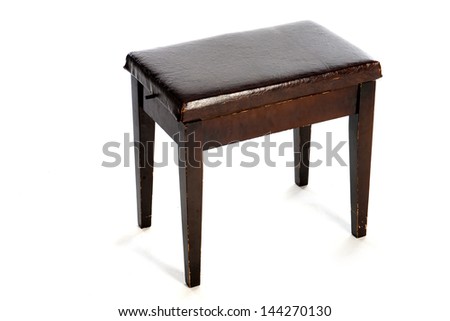 an old piano stool on a white background