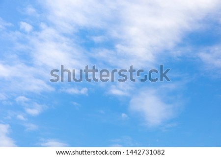 Blue sky and soft white clouds at day time for background.