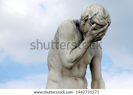 Head in hands: Facepalm statue in Paris, France Royalty-Free Stock Photo #1442731571