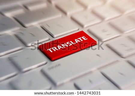 translate button on computer keyboard, translation of languages. blurred in motion background.