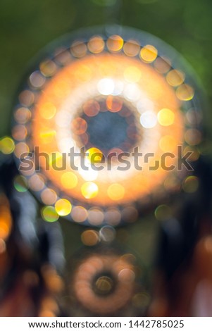 Blurred image, dream catcher native american in the wind with sunlight and blurred light shiny bokeh