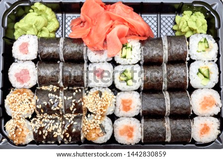 Sushi set. Set of different sushi with seafood. Sushi rolls with different fillings. A dish of traditional Japanese cuisine. Rolls with a variety of seafood. Rolls with oceanic fish and vegetables.