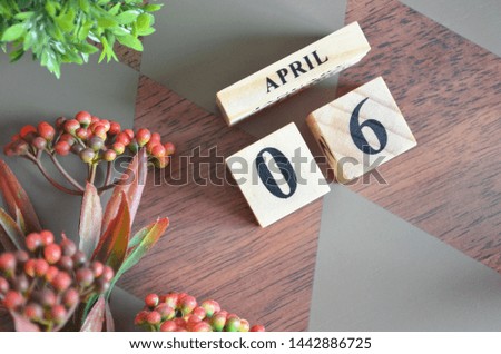 Date of April month. Diamond wood table for background.