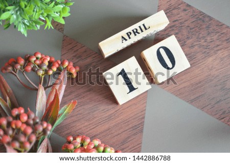 Date of April month. Diamond wood table for background.