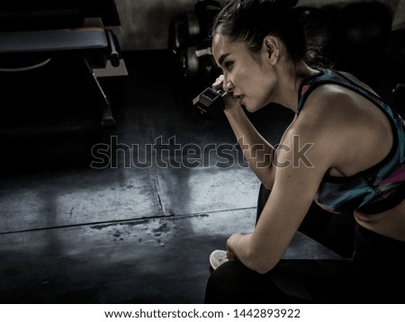 beautiful asian woman exercising in the gym