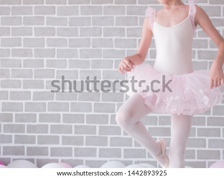beautiful girl in ballet dress danceing with copy sapce