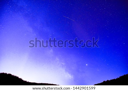 Midsummer Milky Way, Jupiter and Saturn Planets and satellite traces in the night sky.