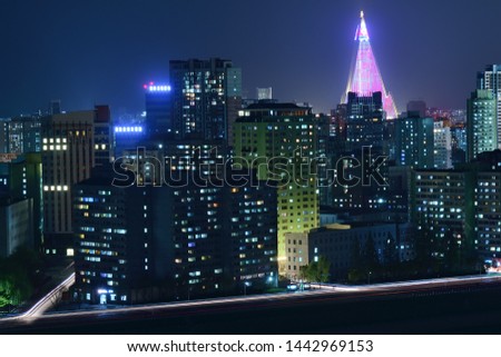 Pyongyang, DPR Korea North Korea. Night view on the modern residential complex and Ryugyong Hotel. View from Yanggakdo island Royalty-Free Stock Photo #1442969153