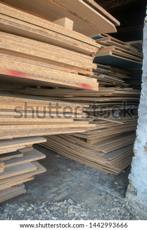 Taking photographs of wood plywood, used for making pellets
