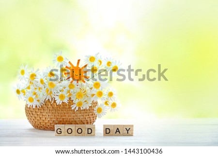 Good day. chamomile flowers, cute paper sun on wooden background. Rustic background with daisies flowers. Summertime season. 
