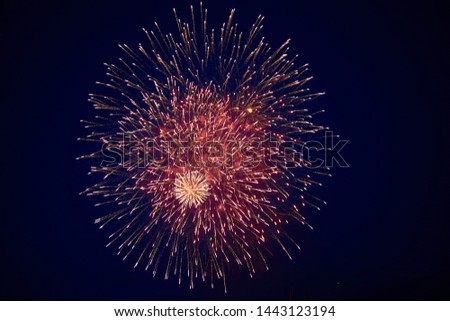 Cheap beautiful bright big fireworks, red, on the night sky, background texture