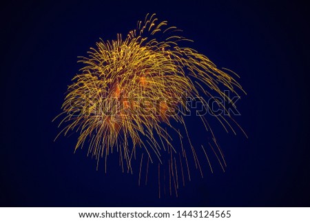 Cheap beautiful sparkling fireworks, golden color, in the night sky, background texture for any purpose