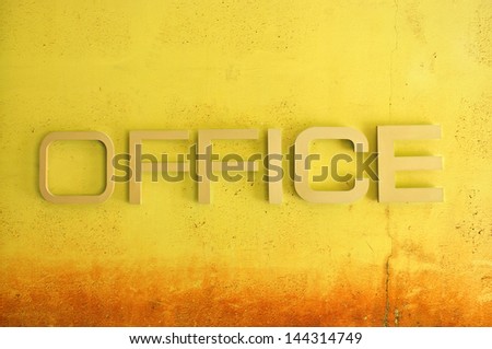 Office text sign on grunge cement wall, textured background