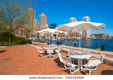 Boston harbor with chairs and umbrella