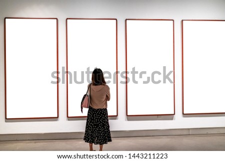 girl in gallery  with blank frame