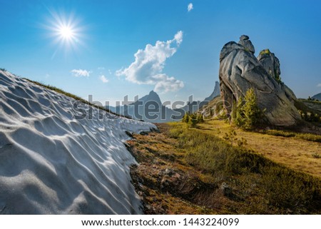 Snow on a mountain hill, rocks, summer, Russia, snow-capped peaks