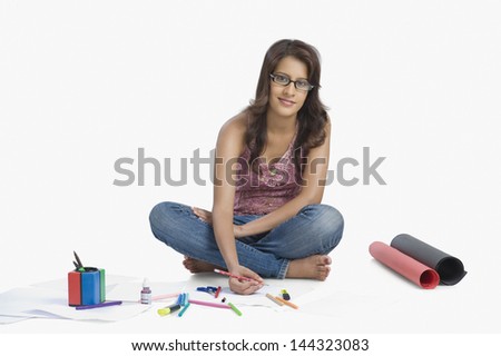 Female fashion designer sketching a dress