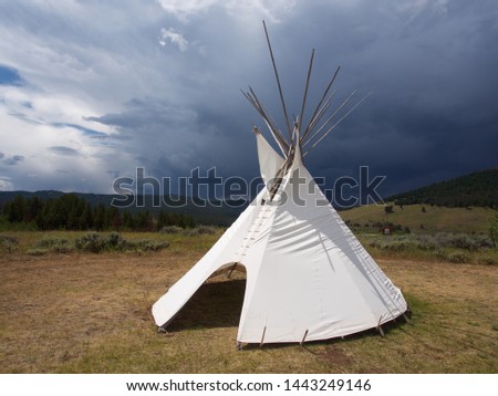 Tepee with Dark Storm Clouds    