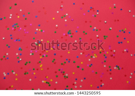 Colorful star on red trendy background. Festive backdrop for your projects.