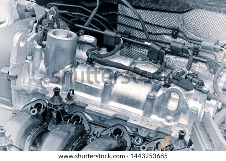 car engine for auto vehicle in service closeup front side view of parts of modern motor metal body which partially disassembled for repair of engine components tech reference background photo