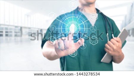 young doctor with hospital background