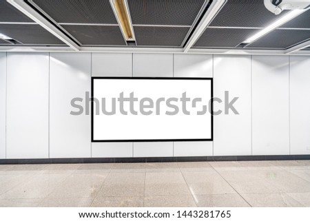 Blank advertising display in subway station underpass public area